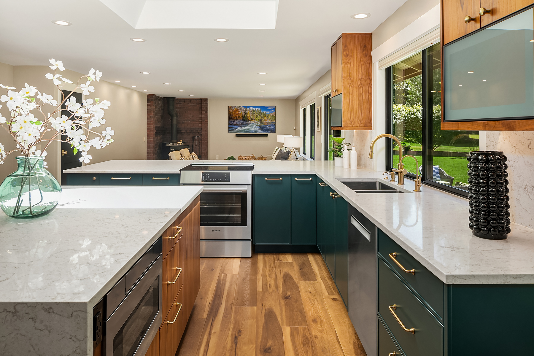 Kitchen remodel with teal cabinetry and walnut island