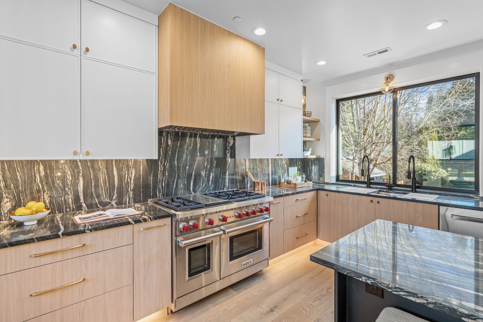 Kirkland new construction kitchen with three-tone cabinetry and Brazilian quartzite by Rayna Vogel Interior Design